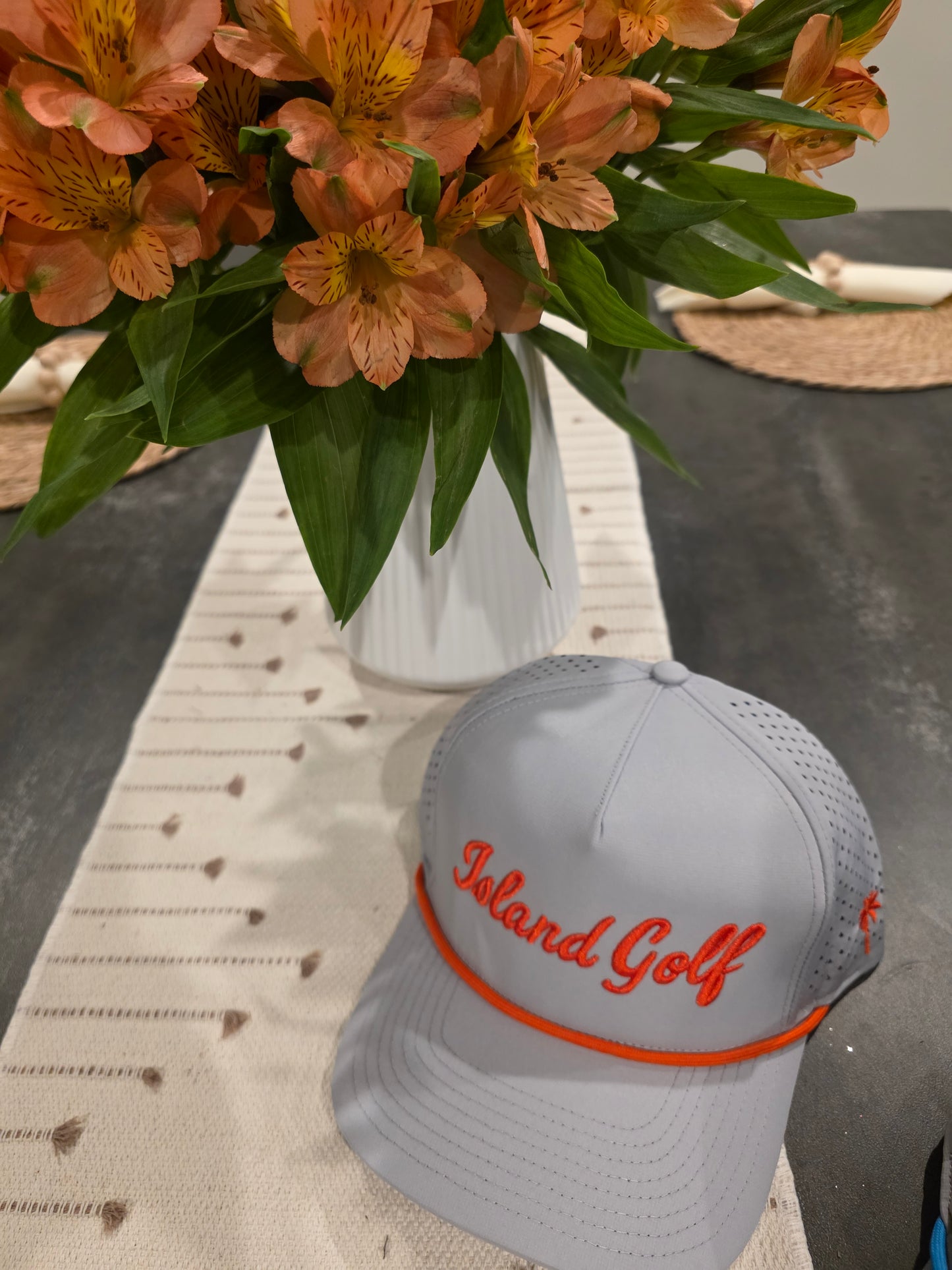 Orange on Grey "Island Golf" hat.  Snap back
